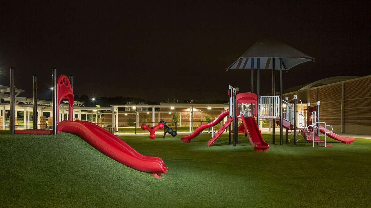Nighttime artificial turf playground by Southwest Greens Ontario